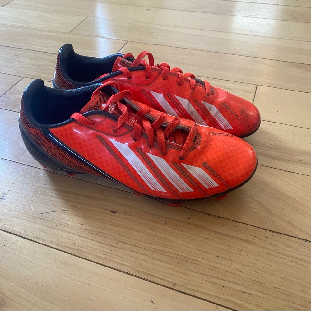 Adidas F10 Bright Orange cleats with White Stripes - youth